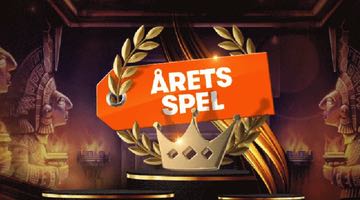 Banner för omröstningen "Årets spel" 2023 hos betsson. En gyllene lagerkrans med etiketten Årets spel placerad på ett podium med en guldkrona. 